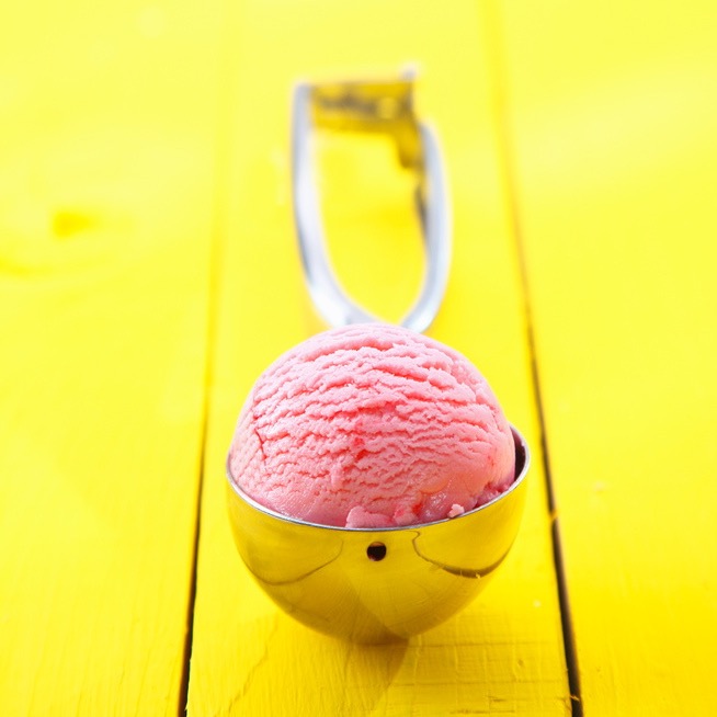 Ice cream scoop with ice cream in it Ice cream scoop with ice cream in it