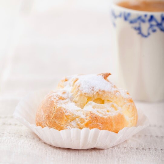 Profiteroles, choux with a custard cream. Dessert