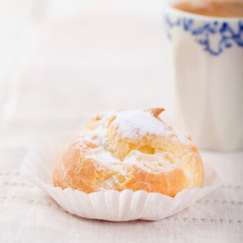 Profiteroles, choux with a custard cream. Dessert Profiteroles, choux with a custard cream. Dessert