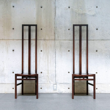 Naoshima Island, Japan- April 12, 2023; Interior view of two chairs against the fair faced concrete walls of the Benesse House contemporary art museum